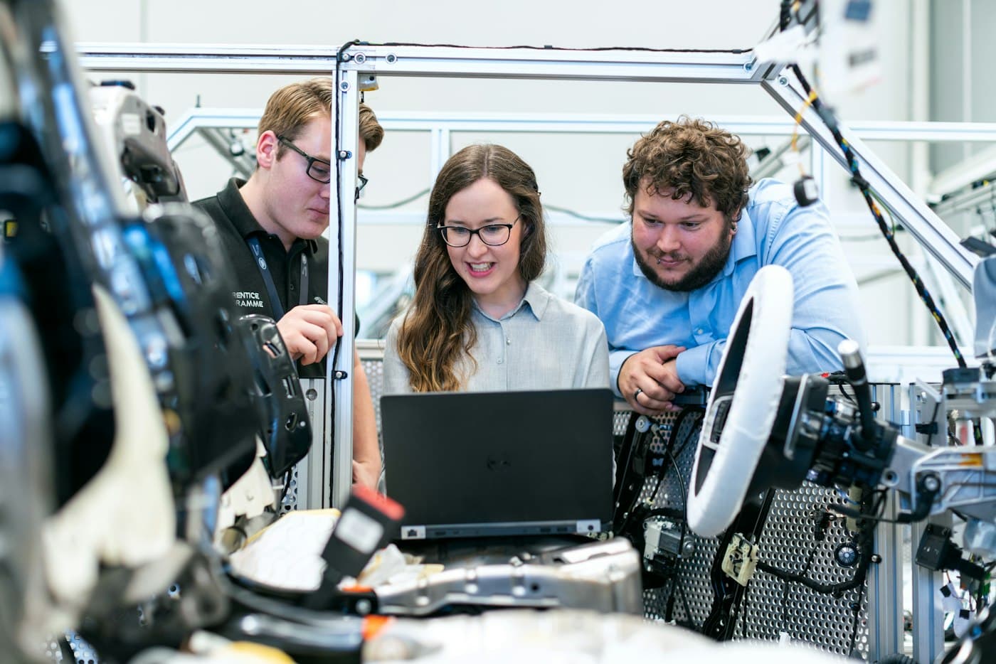 Engineers reviewing data beside industrial equipment