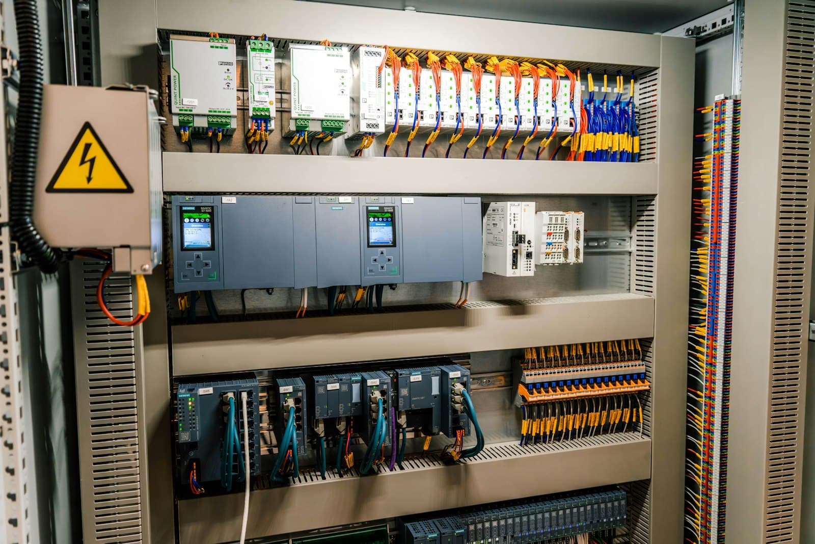 Control cabinet with PLCs, I/O modules and terminal wiring